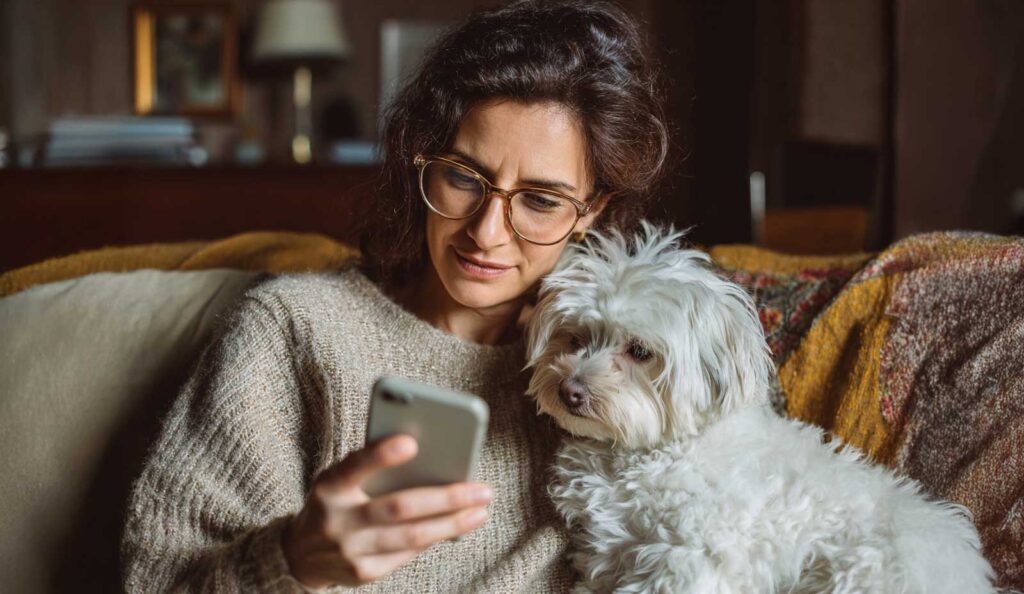 Woman searching for dog boarding using AI
