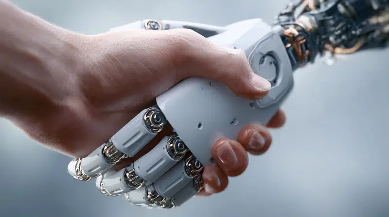 Human hand shaking a robot hand